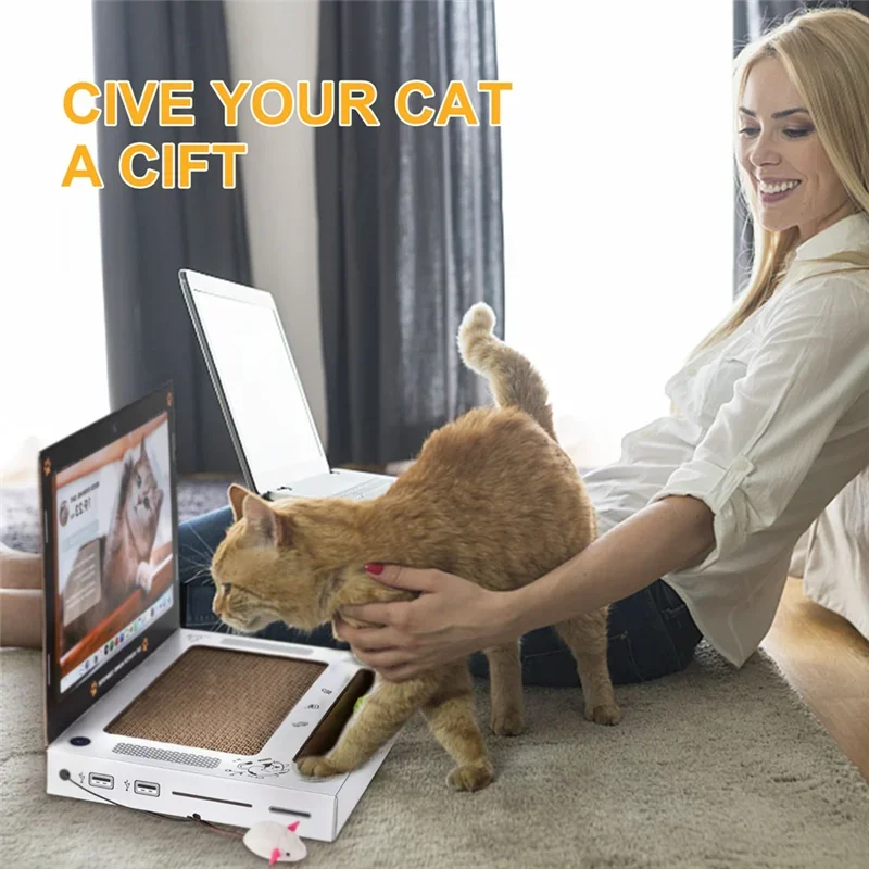 Cat playing on cardboard cat scratcher laptop toy