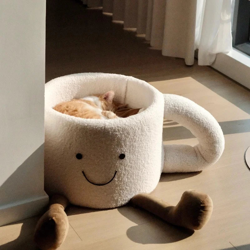 Unique and soft coffee cup cute cat bed showing the large handle and charming face embroidery.