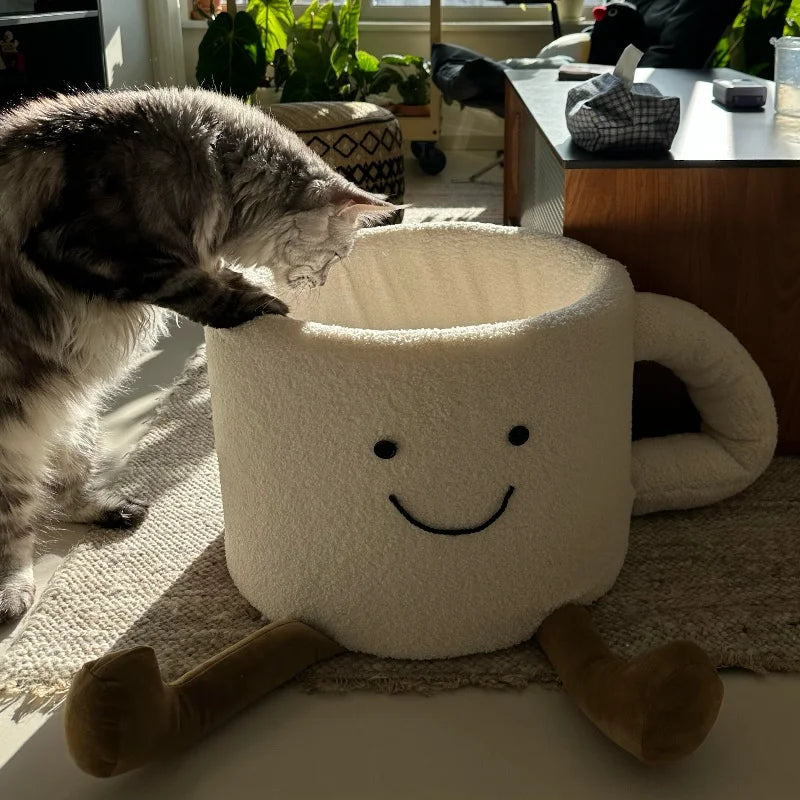 Unique and soft coffee cup cute cat bed showing the large handle and charming face embroidery.
