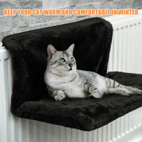 Cat radiator bed with plush fleece cover hanging on radiator
